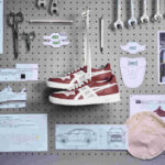 Foto de capa do tênis Asics Japan S Airbag na oficina da Toyota